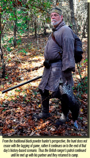 A British ranger carrying a freshly killed wild turkey.